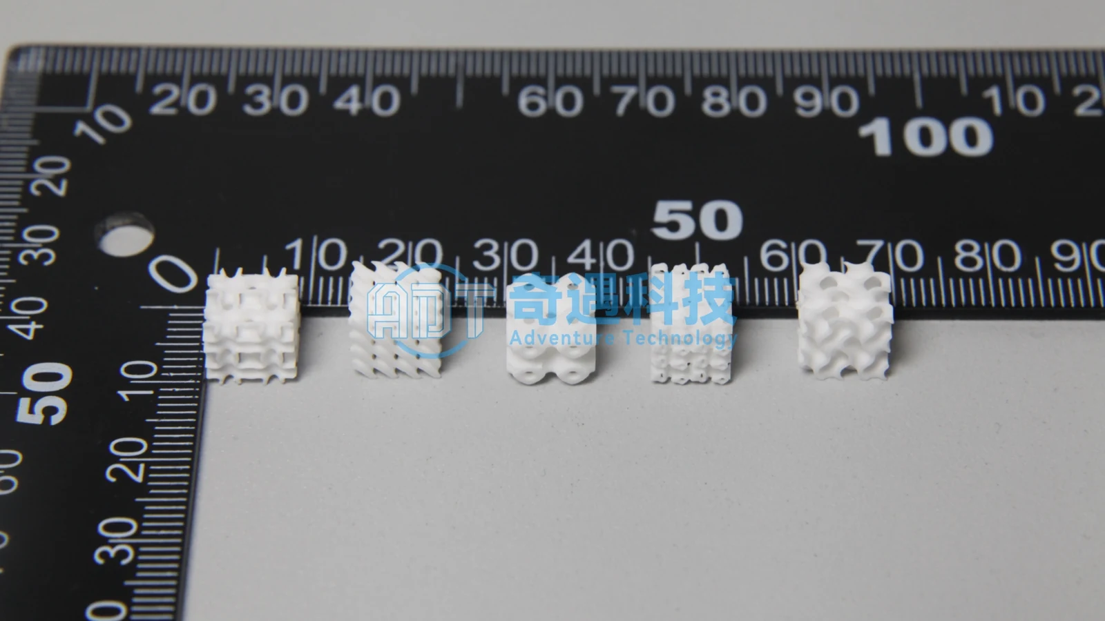 Alumina TPMS samples against a ruler for size comparison