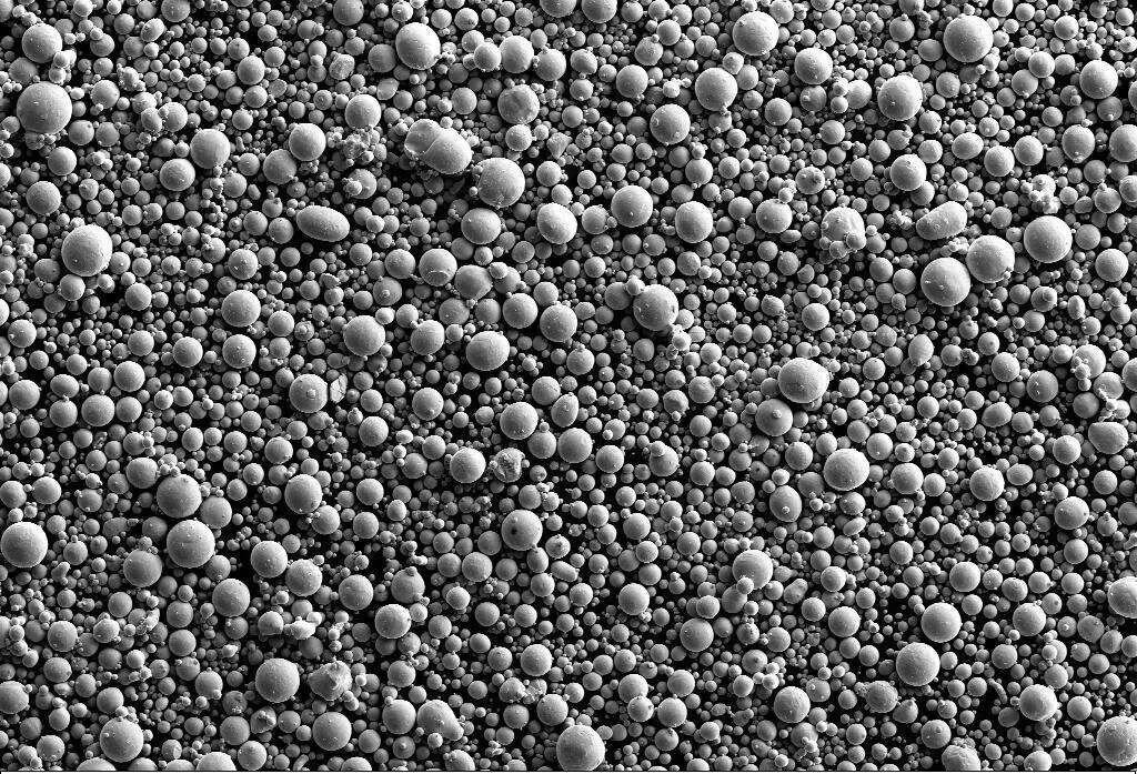 High-energy ball-milled Bayer-process alumina initially shows irregular shapes and lattice distortion (increased c-axis).